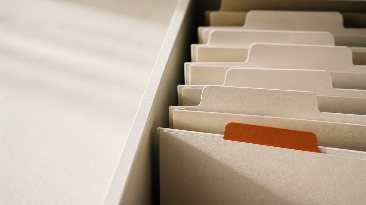 A row of folder tabs in a filing tray