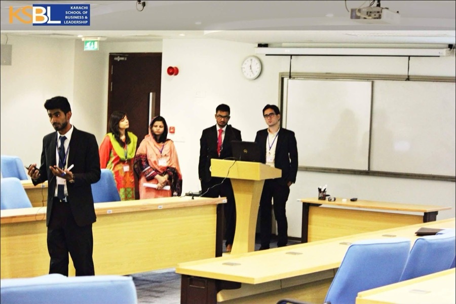 Presenting a marketing case study on stage at the KSBL Marketing Challenge
