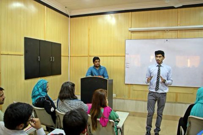 Leading an MUN awareness and training session at a whiteboard