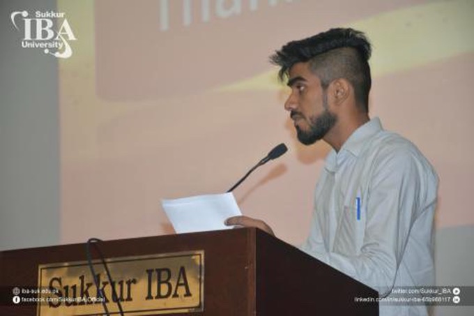 Hosting the NAB annual session at a lectern, Sukkur IBA